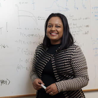 Professor Swati Gupta at a whiteboard