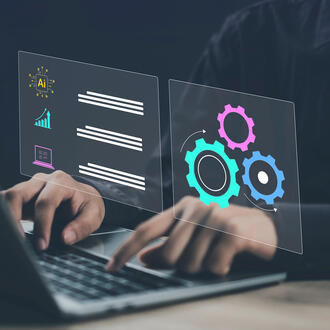 A person using a laptop with an AI symbol as well as gears/agile and productivity symbols