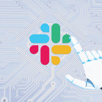 A robot hand touches the Slack logo on top of a circuit board
