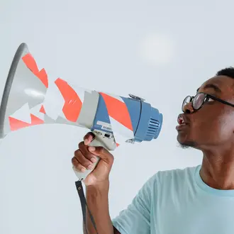 Image of a young man with a megaphone
