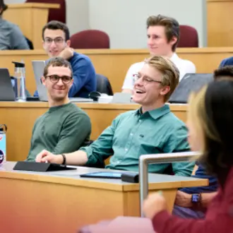 Students in the Masters of Business Analytics program listen in a lecture hall