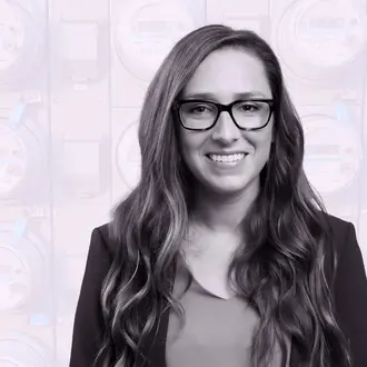 Jacqueline Pless amongst a background of digital electricity meters