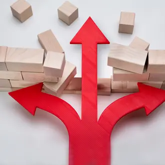 An arrow breaks through a wall of wooden blocks