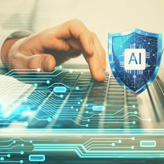 A person types on a computer with an AI cybersecurity shield