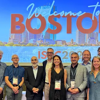 Members of the En-ROADS Team Receiving the System Dynamics Applications Award