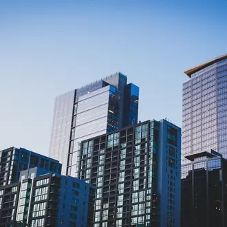 Photo of skycrapers against a clear blue sky