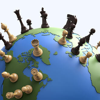 The world globe covered in chess pieces