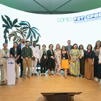 Large group of people pose for a photo at an event.