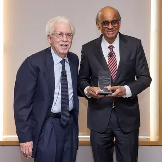 President Tharman Shanmugaratnam receiving the Miriam Pozen Prize from Bob Pozen