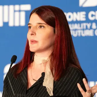 Scholar Zana Buçinca speaking at an MIT event
