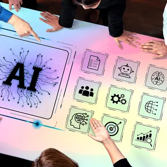 Employees surround a table with various AI graphics