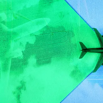 An airplane flies across the green sky, revealing the new green technology like solar and green aviation fuel