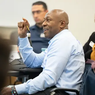 Patrick Parker, EMBA '24, in class answering a question