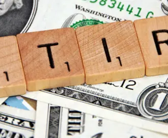 Scrabble letters spelling out "retire"