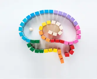 A series of colorful blocks arranged in maze-like shape imitating a brain