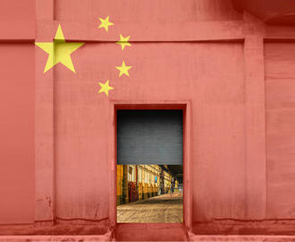 A warehouse painted in the colors of China's flag is half-open