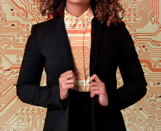 A business person wears a suit with a circuit board pattern