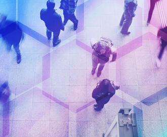 A crowd of workers walking juxtaposed with hexagon shapes