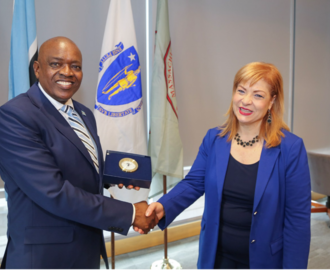 Photo of man and woman shaking hands and smiling to camera
