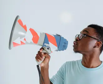 Image of a young man with a megaphone