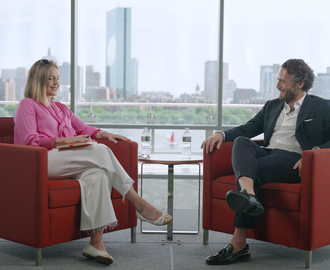 Fiona Murray and Raafat Azzouz sit facing each other and chatting