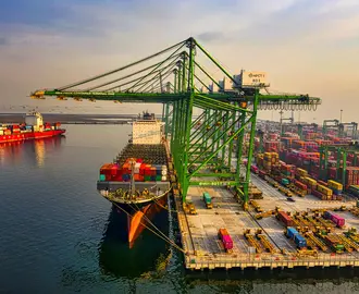 Image of a cargo ship and containers at a port