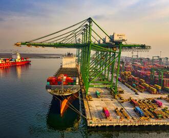 Image of a cargo ship and containers at a port