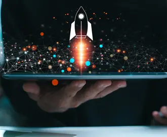 A business person uses a tablet is shown with a rocket symbol blasting off and shooting out of the screen with ai imagery