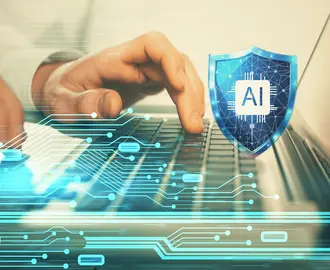 A person types on a computer with an AI cybersecurity shield