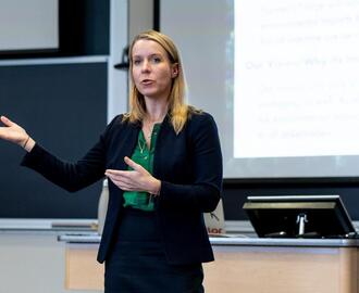 Bethany Patten speaking in a classroom.