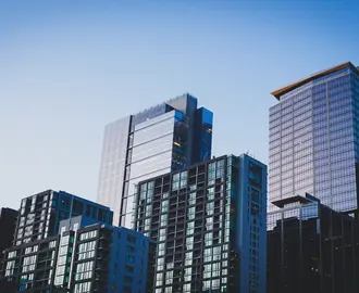 Photo of skycrapers against a clear blue sky