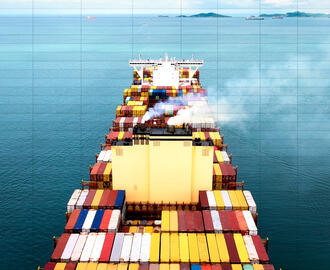A cargo ship sails in the sea with emissions. A spreadsheet is overlayed on top.