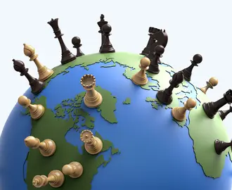 The world globe covered in chess pieces