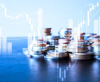 A stack of coins is overlayed with a stock ticker and bar charts