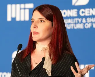 Scholar Zana Buçinca speaking at an MIT event