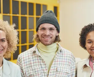 Three smiling employees
