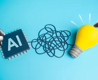 A long wire is between an AI chip and a lightbulb