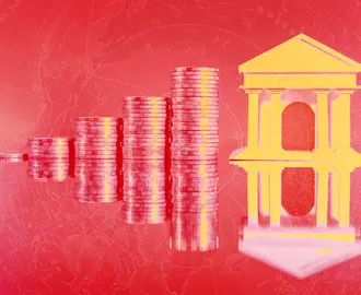 A reflection of stacking coins and a financial building in red and yellow