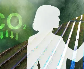 A person looks at a lightbulb, while half of the background is covered in solar and the other half is trees with the symbol of CO2 emissions decreasing