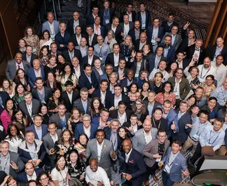 Large group of people pose for photo