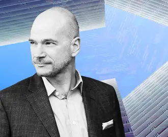 Andrew McAfee and buildings forming an arrow with code