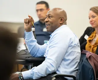 Patrick Parker, EMBA '24, in class answering a question