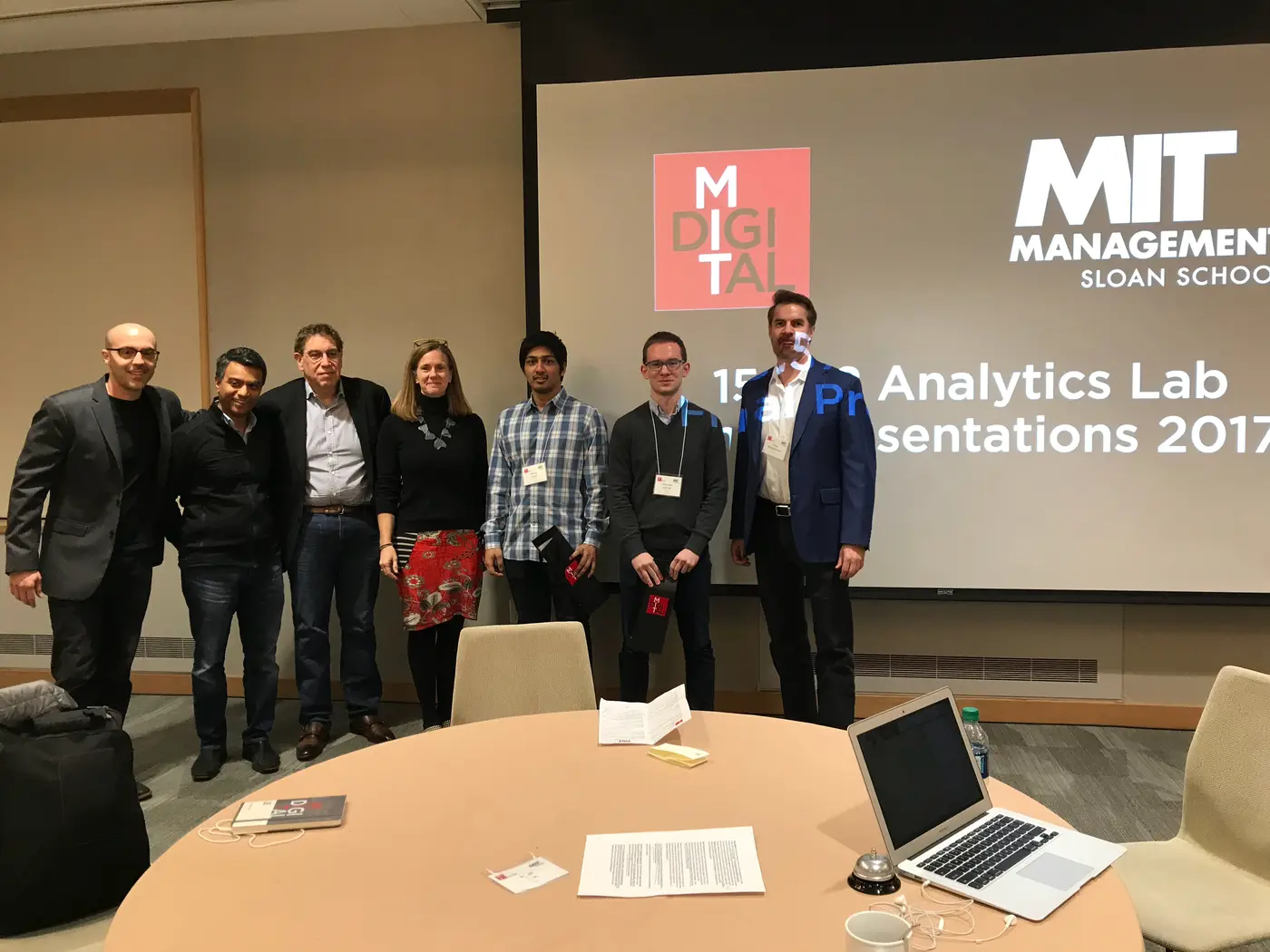 Sinan Aral (far left) and Erik Brynjolfsson (far right), with judges and winning students.