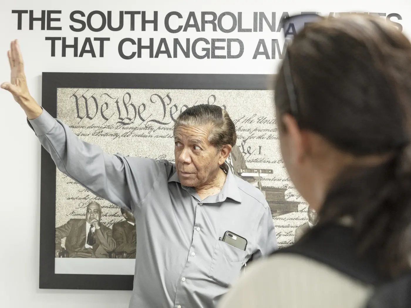 Cecil Williams showing an exhibit in his civil rights museum to USA Lab students
