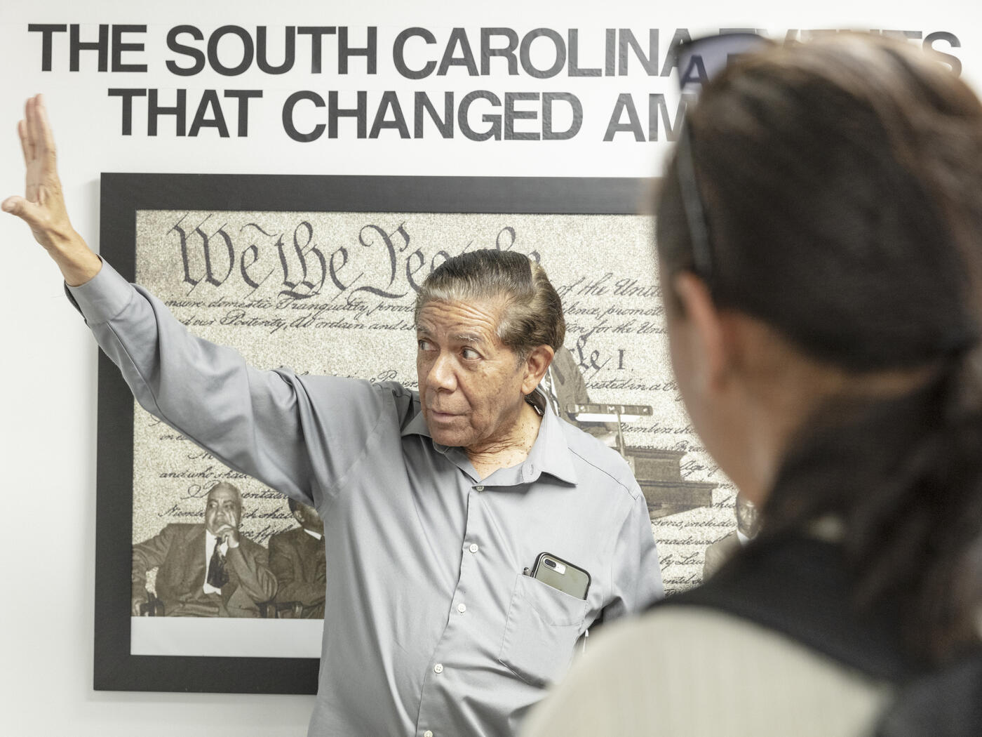 Cecil Williams showing an exhibit in his civil rights museum to USA Lab students