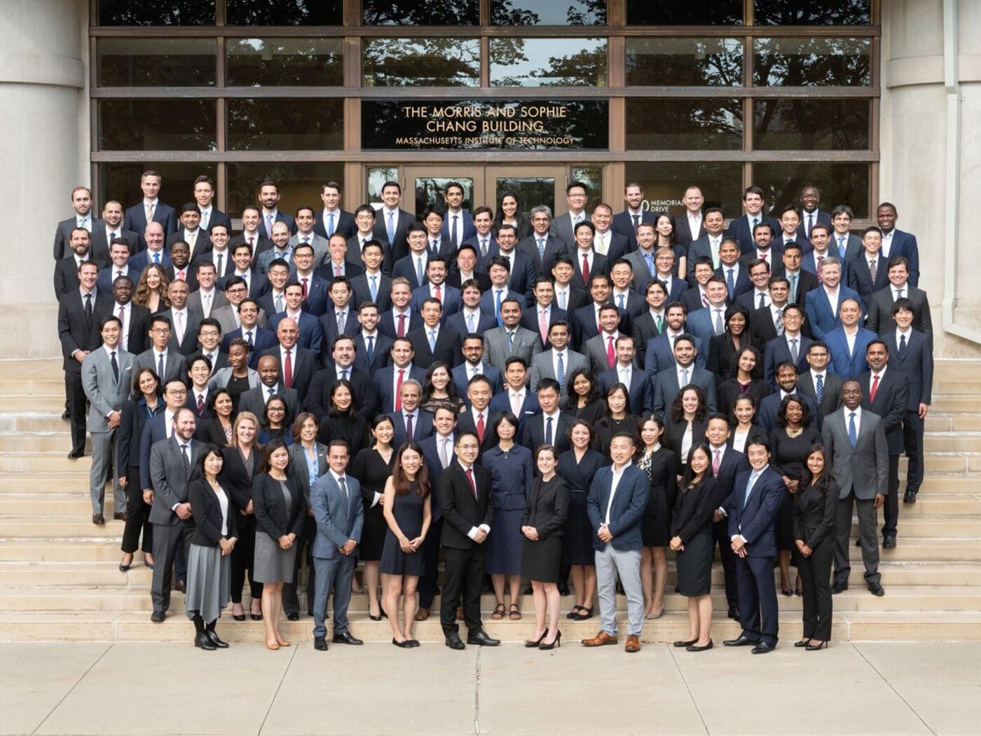 The SFMBA class of 2022 standing on the front steps leading into the Morris and Sophie Chang Building