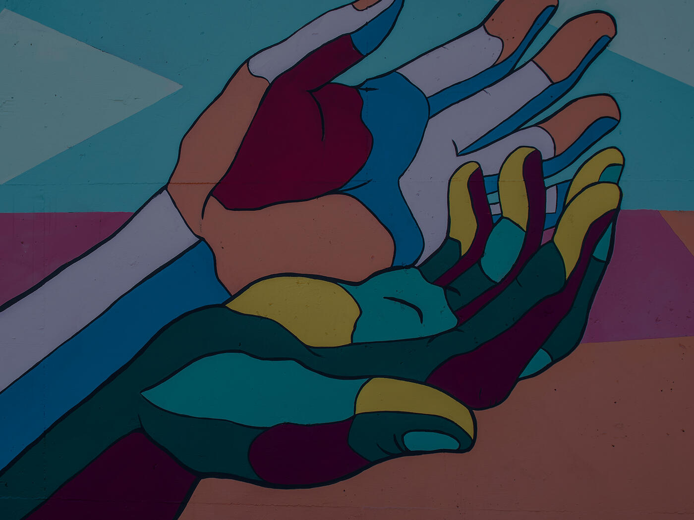 A mural of hands in various colorful colors