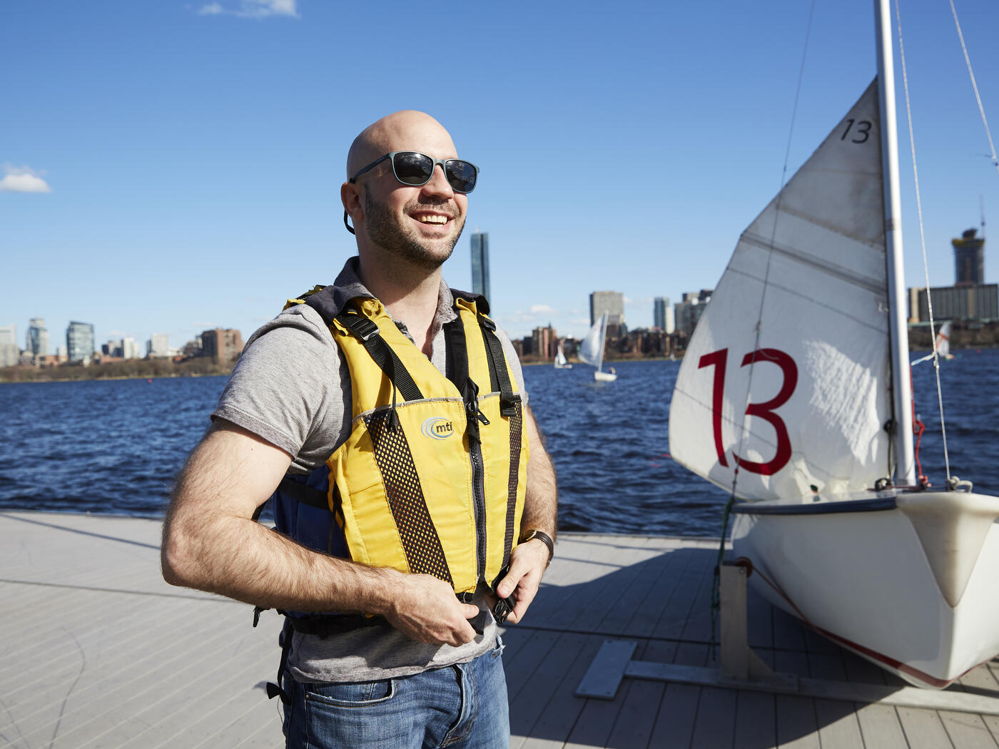 Student preparing to sail at MIT's Sailing Pavilion