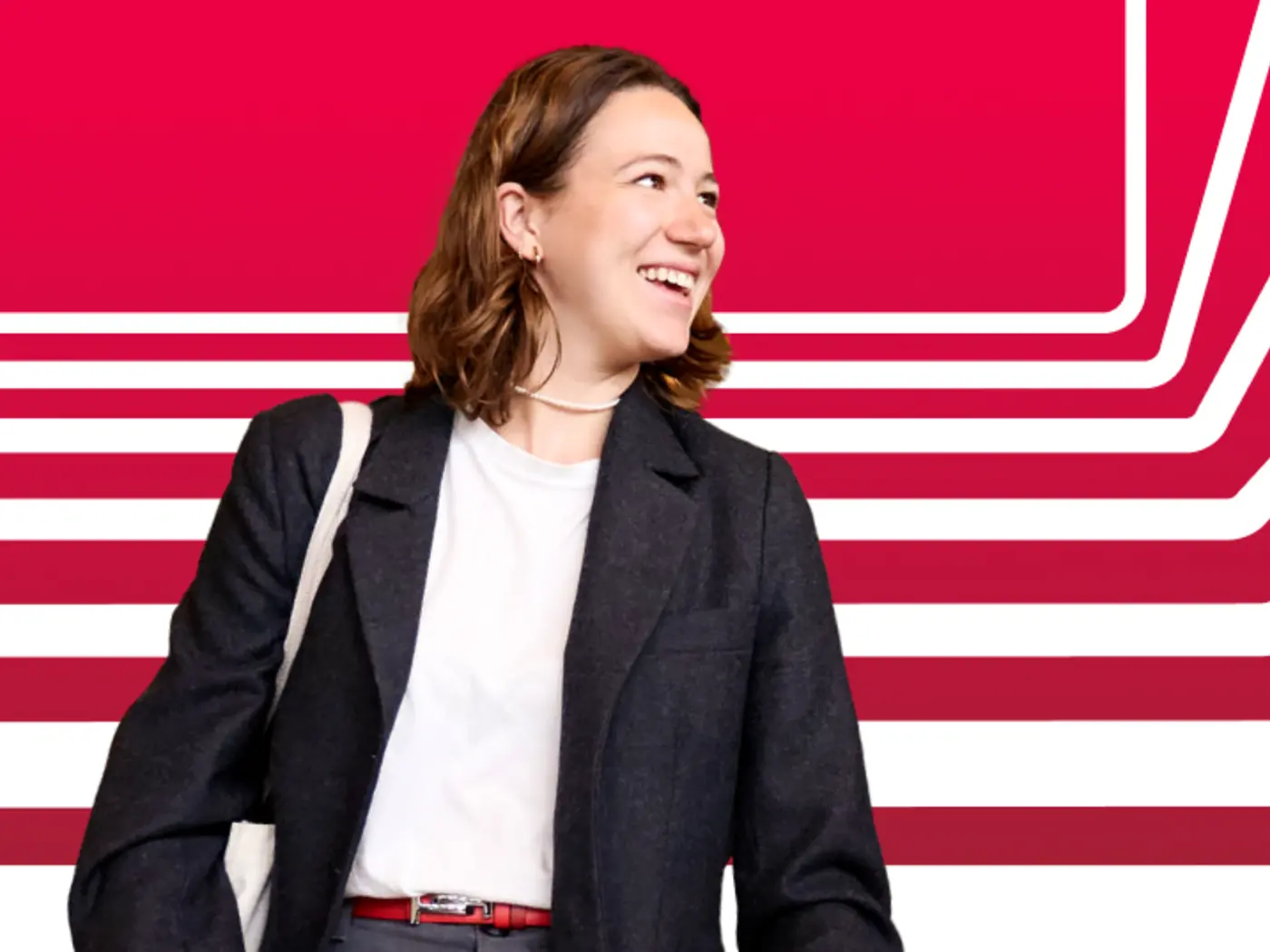 Female student looking to the right against a red background with white stripes