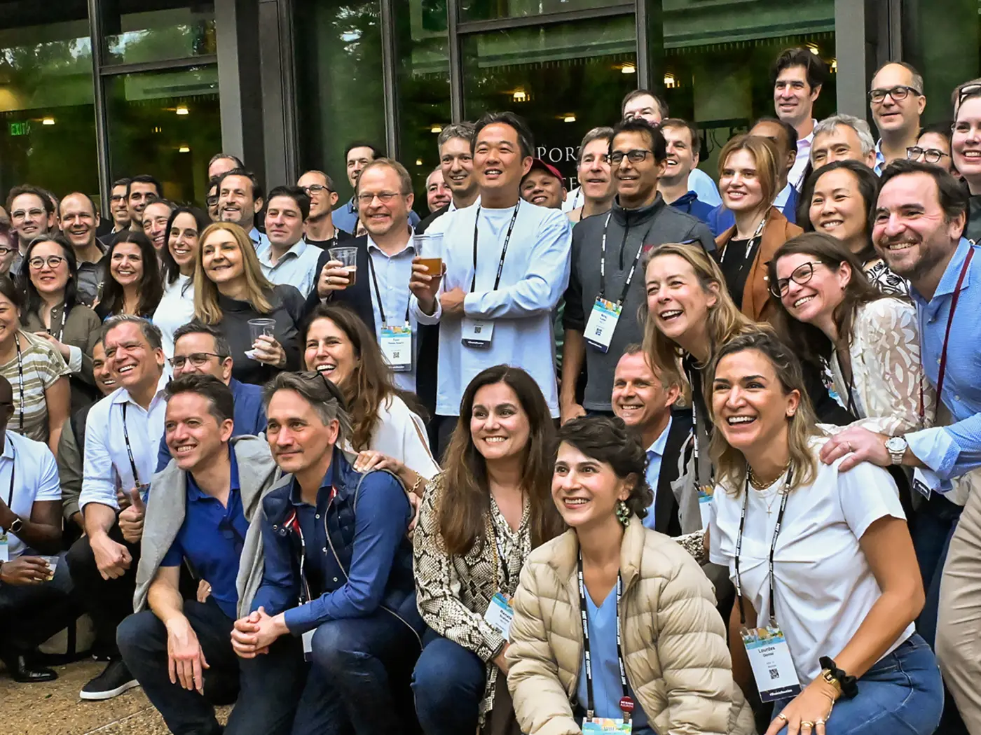 A large group of people poses for a photo off camera